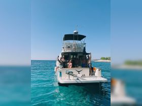 A lively group enjoys a private boat tour, celebrating and having fun on the water — perfect for memorable outings and adventures.