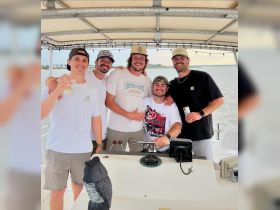 A group of friends enjoys a fun day on the water, celebrating together aboard a boat — perfect for memorable outings and adventures.