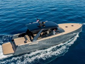 A sleek speedboat navigates through clear blue waters, showcasing its modern design and luxurious features — perfect for thrilling adventures on the sea.