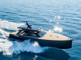 A sleek speedboat glides through sparkling blue waters, showcasing its modern design and performance capabilities — perfect for thrilling adventures on the sea.