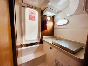 Interior view of a yacht's cabin featuring a clean and functional layout, ideal for comfortable cruising and relaxation.