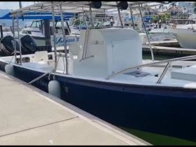 A detailed view of a boat docked at the marina, showcasing its structure and design — perfect for those interested in boat features and specifications.