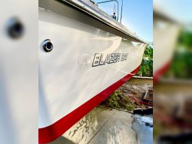 Close-up view of a Blazer Bay boat showcasing its sleek design and vibrant colors, perfect for fishing or leisure outings.