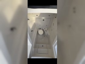 Interior view of a boat bathroom, showcasing the clean and functional design ideal for onboard convenience.