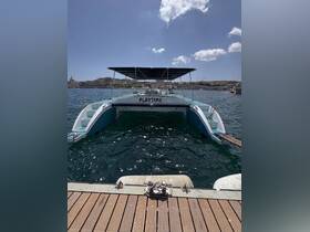 A clear view of the 'PLAYTIME' catamaran docked in calm waters, showcasing its spacious design and inviting atmosphere for a day of fun on the water.