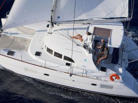 A group enjoys a sailing experience on a Lagoon catamaran, showcasing the perfect blend of relaxation and adventure on the open water.