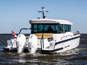 A sleek motorboat cruising through the water, showcasing its modern design and powerful twin engines — perfect for day trips and water adventures.