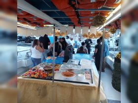 A vibrant setup of snacks and refreshments on a boat, perfect for a festive gathering or celebration with friends and family.