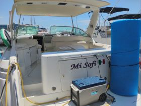 The interior of the boat 'Mi Sofi' showcases a spacious cabin with seating and a console, perfect for relaxing on the water.