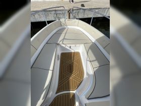 A clean and stylish interior view of a Marinello boat, showcasing comfortable seating and a well-designed helm area, perfect for a day on the water.