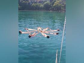A group of friends enjoys a fun day floating together in clear turquoise waters, showcasing the perfect summer getaway experience.