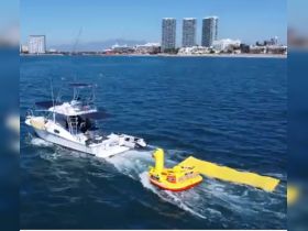 A speedboat pulls a colorful inflatable duck while cruising through clear waters, showcasing fun on-water activities perfect for family outings or group adventures.