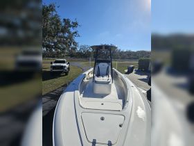 A sleek center console boat is showcased in a sunny setting, perfect for fishing or leisure outings on the water.