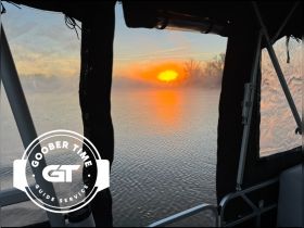 A serene sunset view from inside a boat, showcasing the tranquil waters and vibrant colors of the evening sky — perfect for peaceful evening cruises.