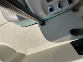 Interior view of a boat's helm area, showcasing the clean and functional design — perfect for navigating the waters.
