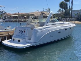 A sleek Rinker yacht named 'Keilani' docked in calm waters, showcasing its elegant design and perfect for leisurely outings in San Diego.