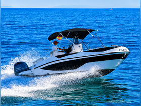 A speedboat cuts through the clear blue waters, showcasing an exhilarating ride on the open sea — perfect for adventure seekers.
