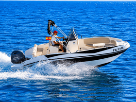 A speedboat navigates through the sparkling blue waters, showcasing an exhilarating day on the sea.