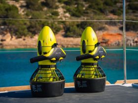 Two Nautica jet skis displayed on the deck, ready for adventure on the crystal-clear waters — perfect for thrilling water sports activities.