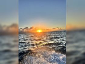 A stunning sunset over the ocean, capturing the serene beauty of nature — perfect for romantic evenings or peaceful boat rides.
