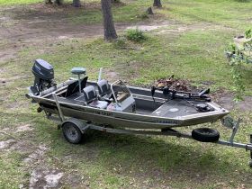A custom craft boat on its trailer, showcasing its sleek design and ready for the next fishing adventure.