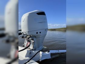 Close-up of a Suzuki outboard engine, showcasing its sleek design and functionality, ideal for boating enthusiasts looking for reliable power on the water.