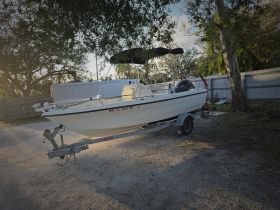 A well-maintained speedboat is docked, showcasing its sleek design and ready for adventure on the water.