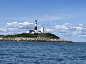 A stunning view of a historic lighthouse on a picturesque coastline, perfect for capturing the beauty of maritime landmarks.