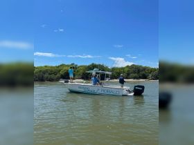 A group of anglers enjoys a day of fishing aboard a Robalo boat, showcasing the perfect outdoor adventure on the water.