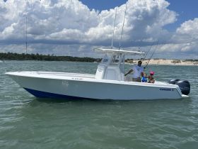 A family enjoys a day of fishing on a sleek Contender boat, creating lasting memories on the water.