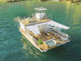 A stunning aerial view of a luxurious houseboat featuring a jacuzzi and spacious deck, perfect for relaxing on the water.
