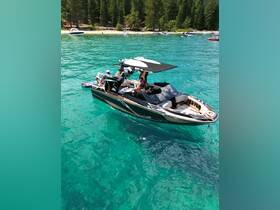 A lively group enjoys a sunny day on a boat in clear turquoise waters, perfect for summer adventures and water activities.