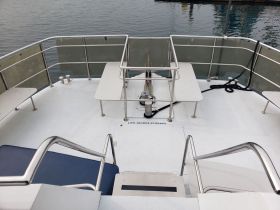 Interior view of a boat's seating area, showcasing a clean and spacious layout ideal for relaxation and socializing while on the water.