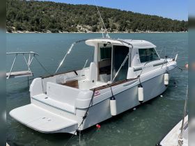A pristine view of a docked yacht, showcasing its sleek design and tranquil surroundings — perfect for a relaxing day on the water.
