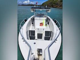 An interior view of a boat's helm and seating area, showcasing the layout and equipment for a comfortable boating experience.