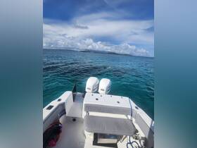 A scenic view from a boat with snorkelers enjoying the clear turquoise waters, perfect for aquatic adventures and exploration.
