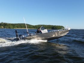 A sleek speedboat navigates through the water, showcasing an exciting day on the lake. Perfect for fishing or leisurely cruises.