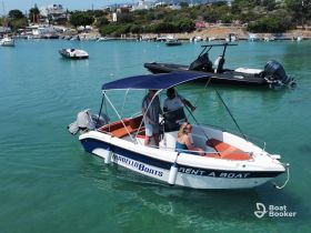 A group enjoys a sunny day on a rental boat, showcasing the perfect summer getaway on the water.