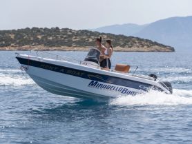 A couple enjoys a thrilling ride on a rental boat, perfect for fishing trips and exploring the beautiful waters.
