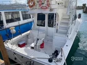 A well-equipped boat interior featuring seating and storage, perfect for fishing trips or leisurely cruises.