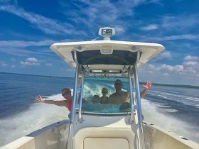 A joyful group enjoys a thrilling ride on a boat, capturing the essence of fun and adventure on the water.