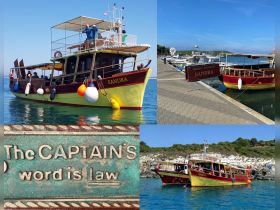 The colorful boat 'Sandra' is docked, showcasing its vibrant design and inviting atmosphere, perfect for excursions on the water.