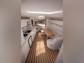 A beautifully designed interior of a boat cabin featuring a cozy seating area and dining table, perfect for relaxing and enjoying meals while at sea.