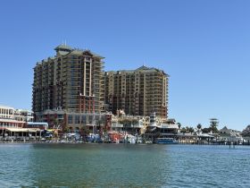 A view of a waterfront area featuring tall buildings and docks, but the focus is unclear.