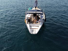 Aerial view of a boat with guests onboard, enjoying a day on the water — perfect for adventure seekers and relaxation enthusiasts.