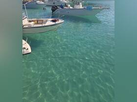 A vibrant scene featuring boats anchored in crystal-clear turquoise waters, with people enjoying a swim nearby — a perfect representation of a fun day on the water.