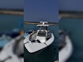 A sleek speedboat docked at the marina, showcasing its modern design and spacious seating, perfect for thrilling water adventures.