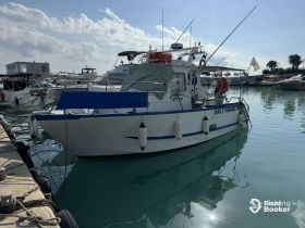 A fishing boat named 'Daily Fishing Trips' docked in a marina, showcasing its structure and surroundings under a clear sky.