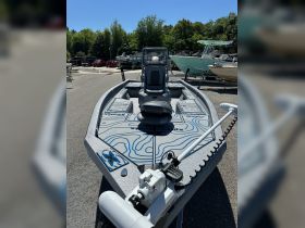 A sleek fishing boat showcased at the dock, featuring a modern design and equipped with advanced fishing gear — perfect for anglers looking for their next adventure.