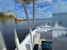 A detailed view of the helm area inside a boat, showcasing the console and navigation equipment, perfect for those looking to explore the waters.
